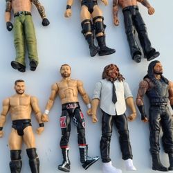 🎯 WWE Action Figures Bundle - Lot of 7 Wrestlers! 🧍‍♂️💥
