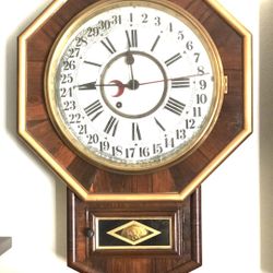 Antique time only wood wall clock