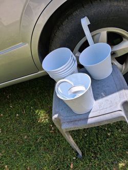 Brand new lot of eight metal hanging flower pots