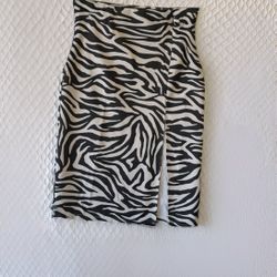 Mid-length stretch skirt with black and gold prints. PRICE: $10.