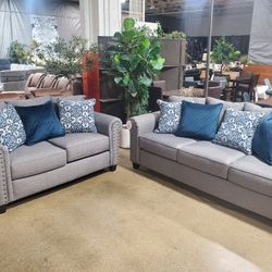 Beautiful 2 pc  Gray sofa love seat with nailheads (New)