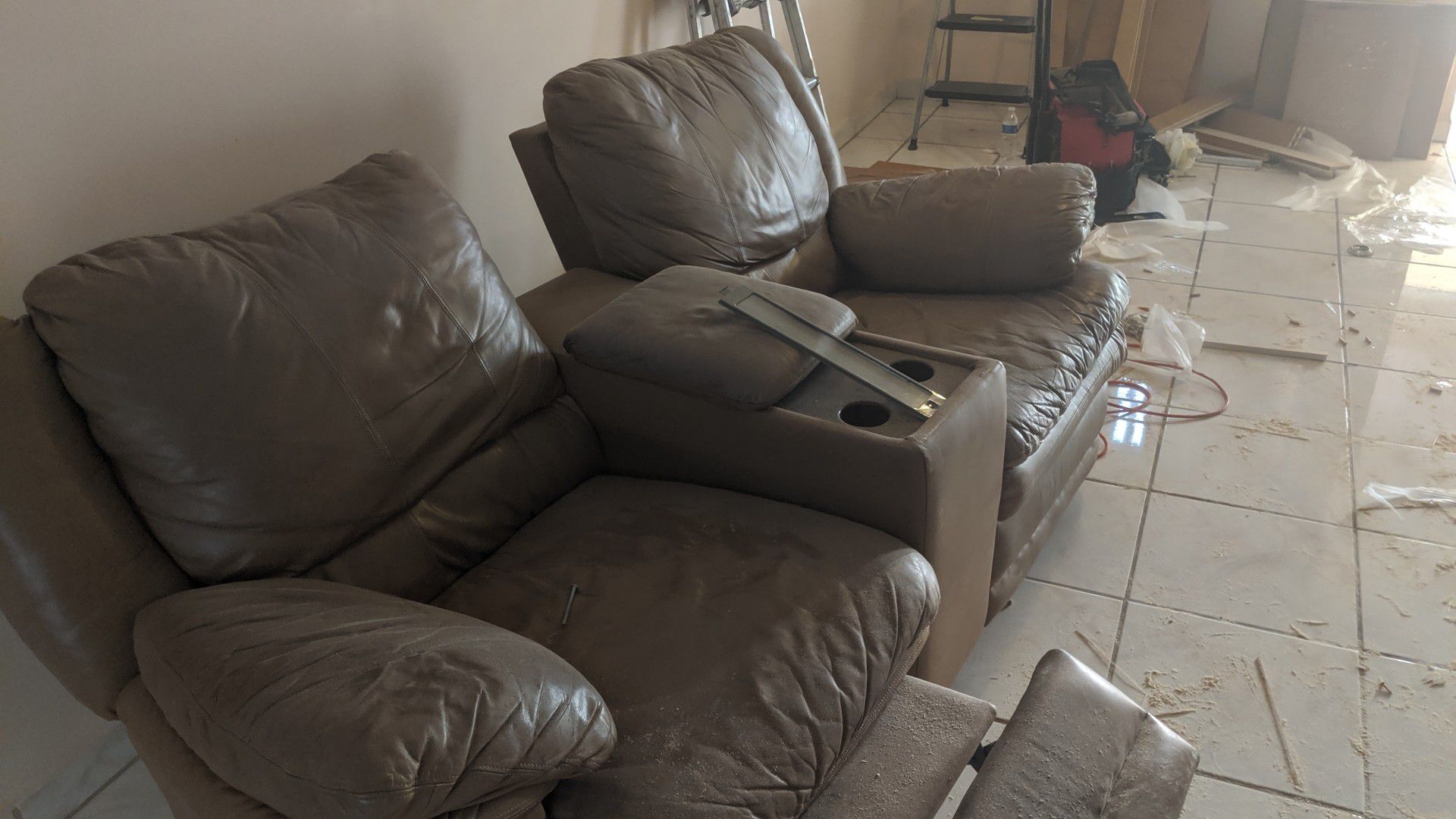 FREE leather sofa footrest on one will not go down