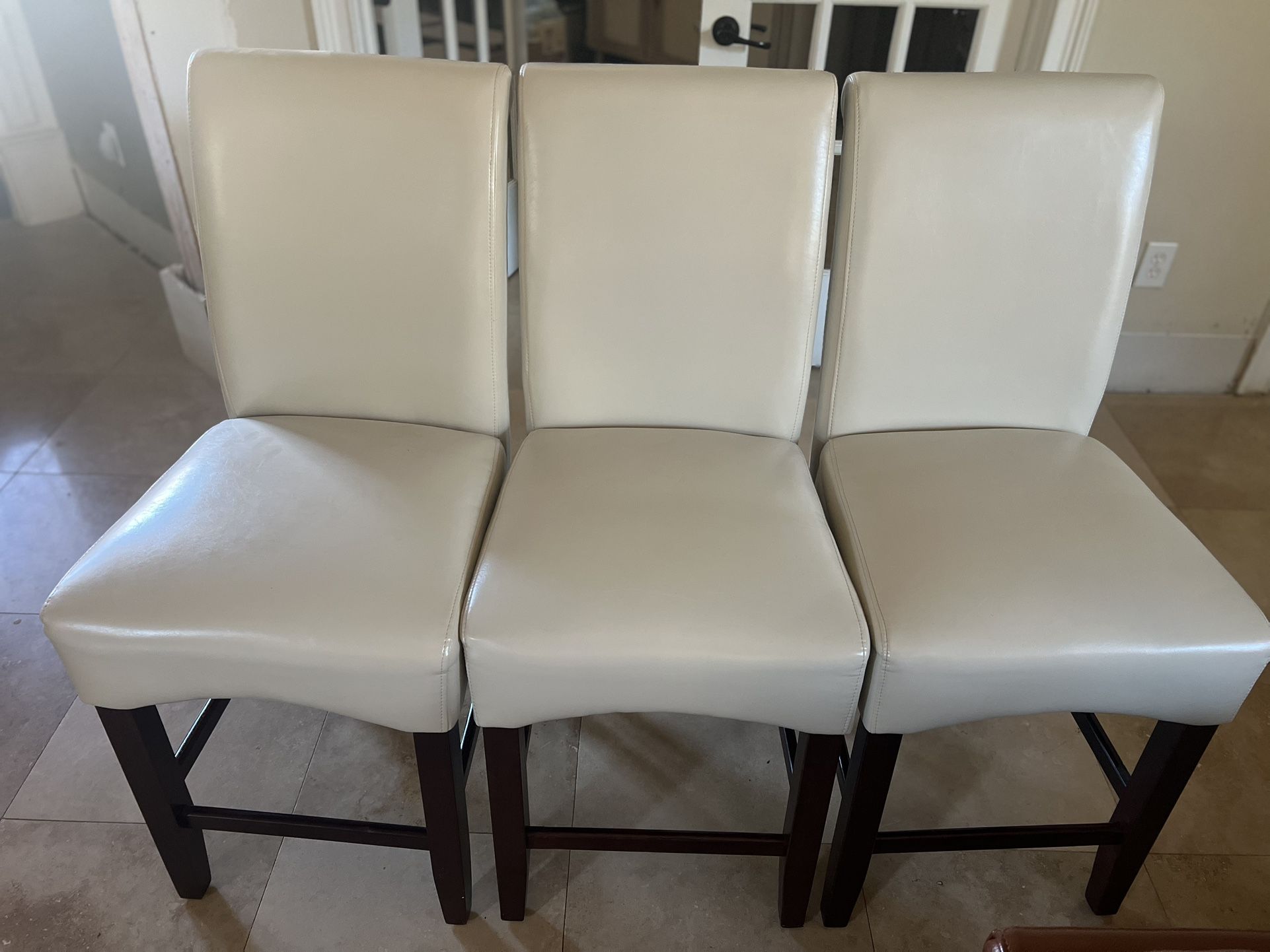 Three Cream Faux Leather Bar Stools