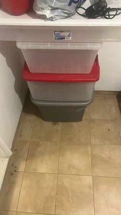 Four plastic storage containers