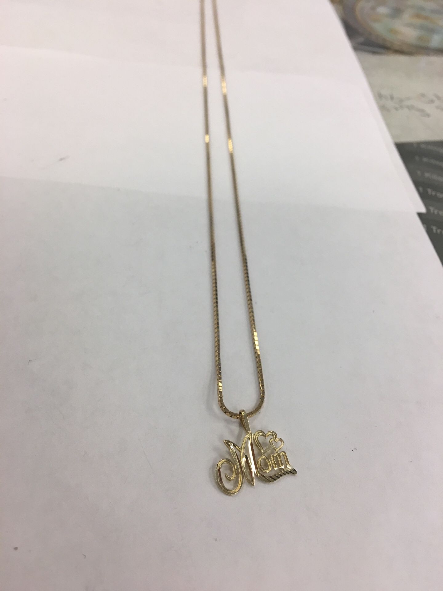 Gold chain with mom pendant