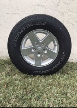 2014 Jeep Wrangler rims and tires.