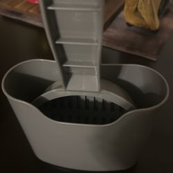 Two cat scoopers, one sweeper, two litter filters