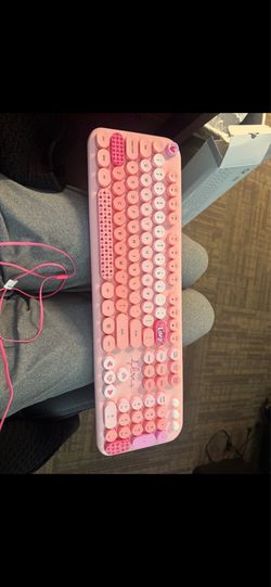 Pink keyboard with mouse and keyboard pad