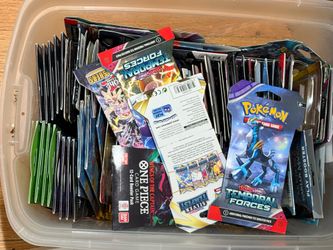 Two bins full of Pokémon magic baseball football basketball trading cards