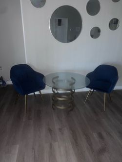 Round Glass Dining Table with 4 Blue Velvet Chairs