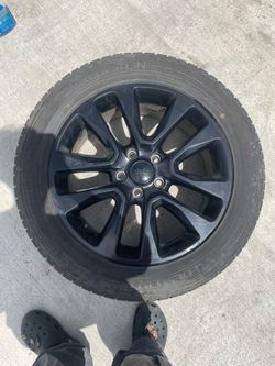 Tire and alloy black rim