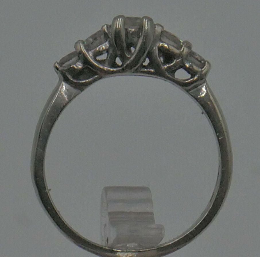 14KT WHITE GOLD ANNIVERSARY BAND SIZE 7.5 3.8 GRAMS WITH 5 DIAMONDS APPROXIMATE CENTER ROUND DIAMOND 0.30 0.35PTS SI2 H; 2 SIDE DIAMONDS 0.16 0.18