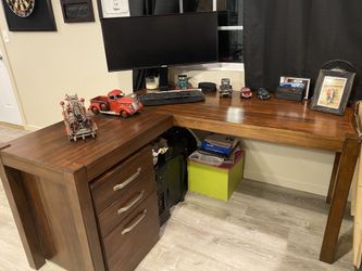 2 computer desks that are exactly the same