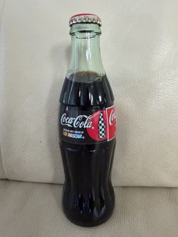 collectible 8 oz glass bottle of Coca-Cola featuring a NASCAR "Official Soft Drink"