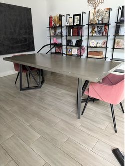 Cement and brass dining table