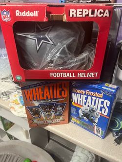 Cowboys helmet and three boxes of old wheates boxes unopened