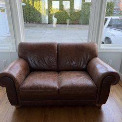 Natuzzi distressed leather love seat