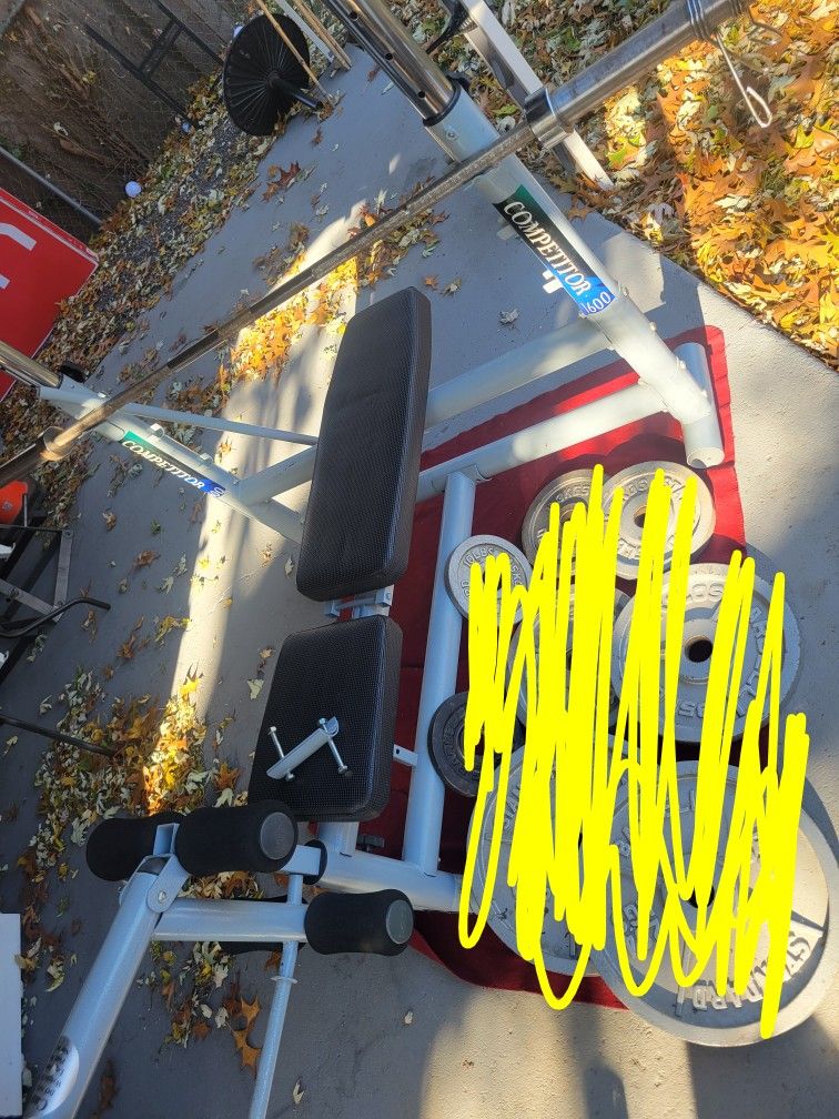 OLYMPIC WEIGHT BENCH  LEG EXTENSION  ADJUSTABLE INCLINE  AND  BAR HEIGHT.   7'  45LB BAR  WITH CLIPS 
11525 S  HALSTED DUNKIN DONUTS/7111.S WESTERN WA