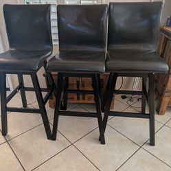 Three espresso leather barstools