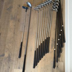 Two Set Of Golf Clubs (1 Incomplete) Driver And Putter Included.