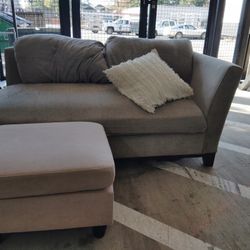 Grey Couch And Leg Resters 