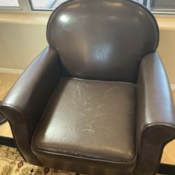 2 Brown faux leather armchairs