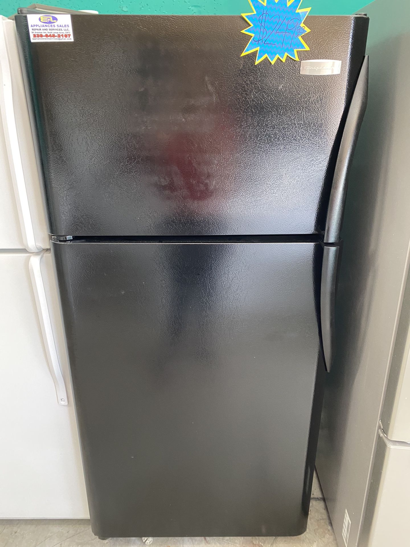 A Black Top And Bottom Frigidaire Refrigerator