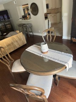 Round dining  or nook table - brown with black base