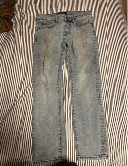 Light Wash Distressed Slim Jeans