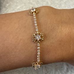 Gold Tone Snowflake Crystal Tennis Bracelet