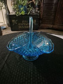 Blue carnival glass basket, no cracks price $40, no less.