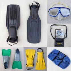 Assortment of scuba gear diving fins swimming flippers water shoes snorkel mask weight belt