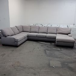 Large light grey sectional couch