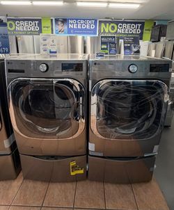 LG 5.2 Cu Ft Mega Capacity Front Load Washer with Pedestal Washer and LG 9.0 Cu Ft Mega Capacity Gas Dryer