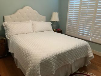 Queen bed with upholstered headboard