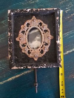 Wall framw with metal hook