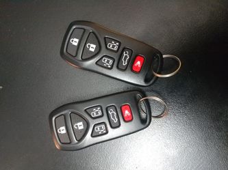 Set of Nissan Quest 6 button remotes.