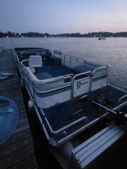 Older working pontoon boat