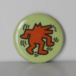 Scarce Original Keith Haring Eighties Pop Art Orange Dancing Dog on Bright Green 1" Pinback Button with Artist's Trademark on Edge


