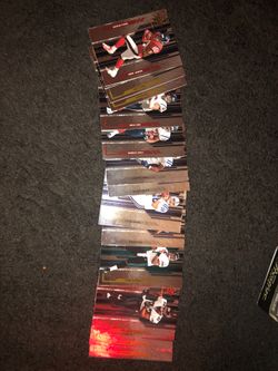 a bunch of old glossy football cards