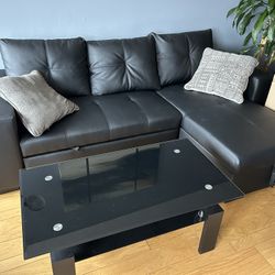 Black Sectional Couch,  Coffee Table and Plant Included 