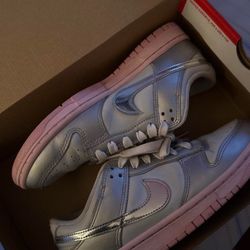 women's Nike Dunk Low LX sneakers in the "Metallic Silver Pink Foam" colorway.