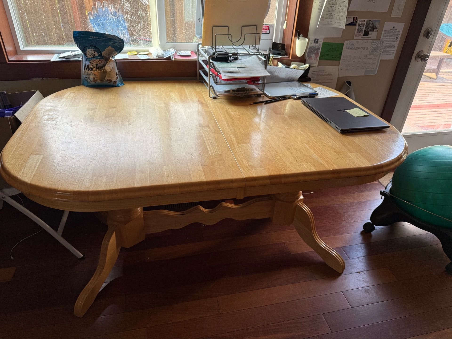 Wooden dining table - expandable with 2 self storing leafs
