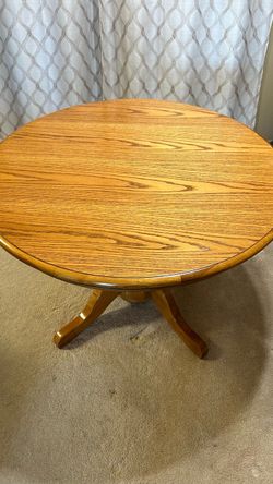 Solid oak dining room table with four chairs