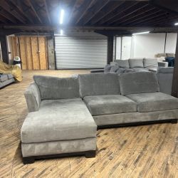Delivery available gray 2-pc sectional couch