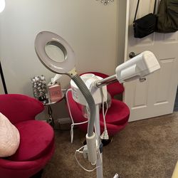 Facial steamer with magnifier