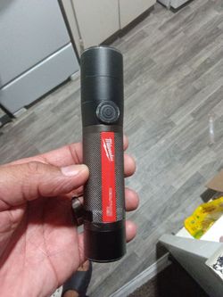 Milwaukee compact rechargeable USB flashlight 3 light modes with red lithium battery