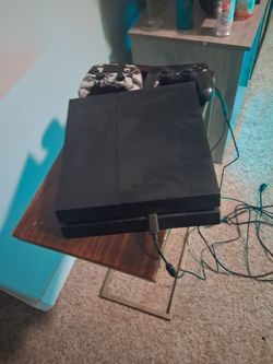 PlayStation 4 Pro Console with Two Controllers