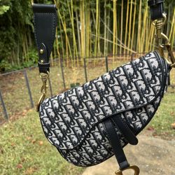 Oblique monogram saddle bag