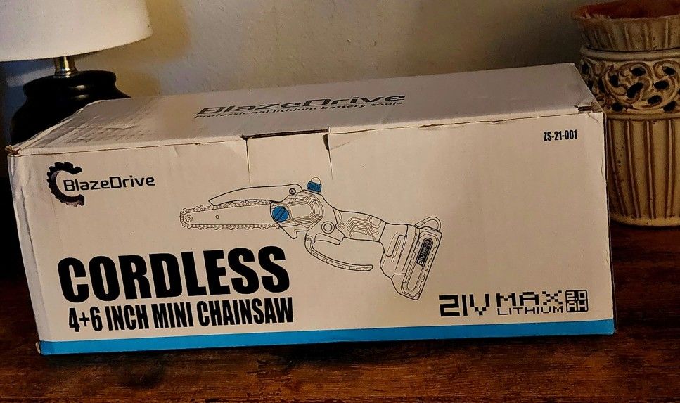 Battery Powered Hand Held Chainsaw.......